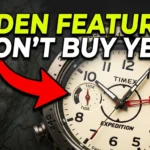 Timex T2N721 dial showing the red compass hand during the two-revolution calibration process for accurate navigation.